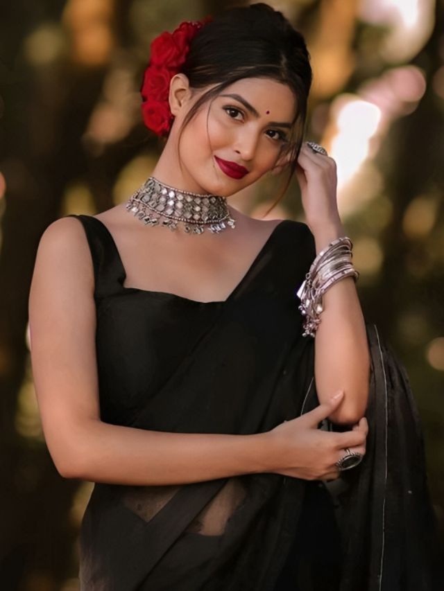 Black Saree with Rose Floral Bun Hairstyle