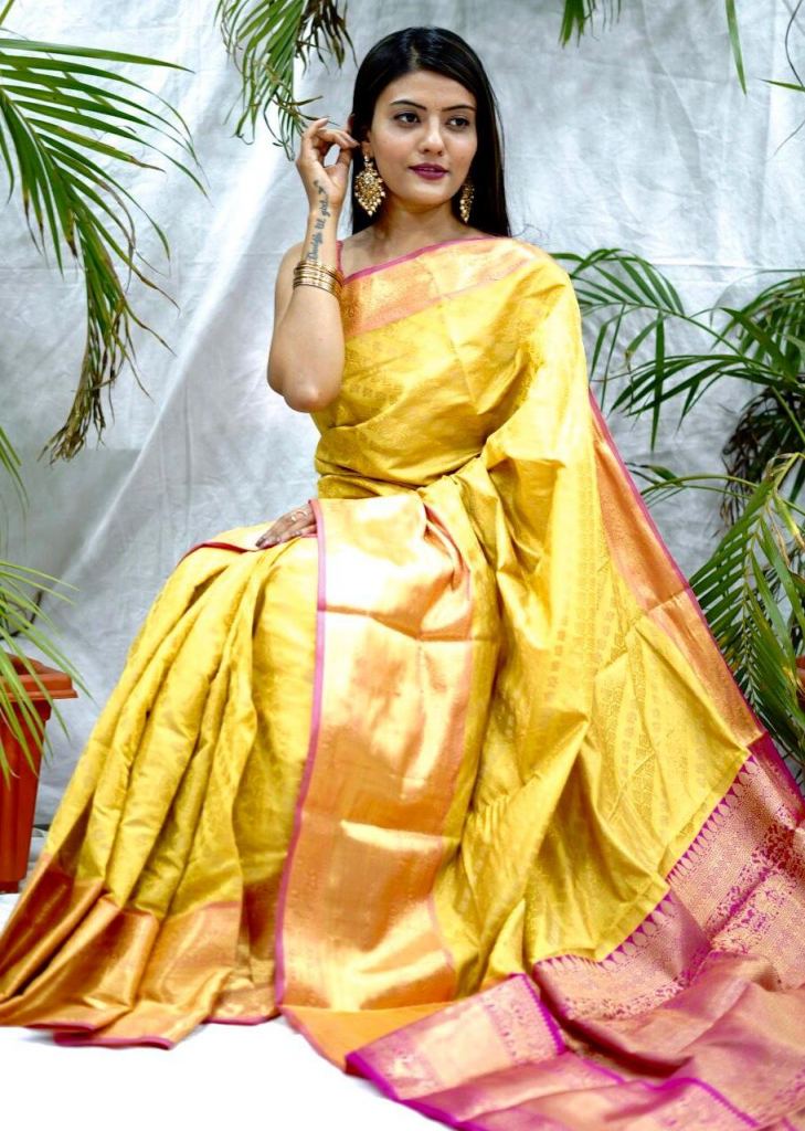 Yellow floral vine kancheepuram wedding silk saree, contrast zari border &  intricate pallu features jaal designs